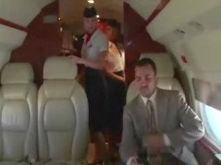 Desiring stewardesses suck their clients hard manhood on the plane