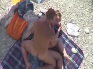 Perky chick caught fucking on the beach by a peeper